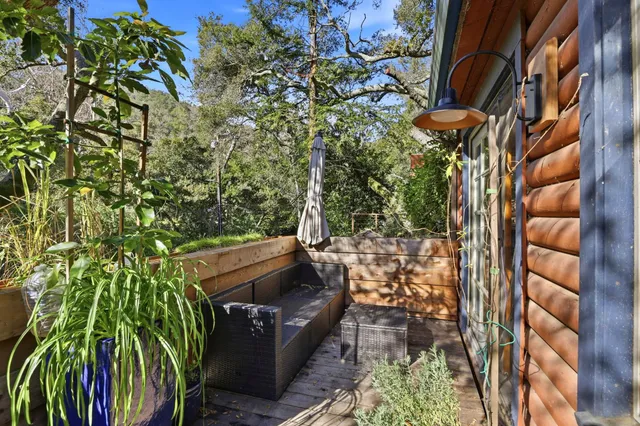a view of a backyard with sitting area