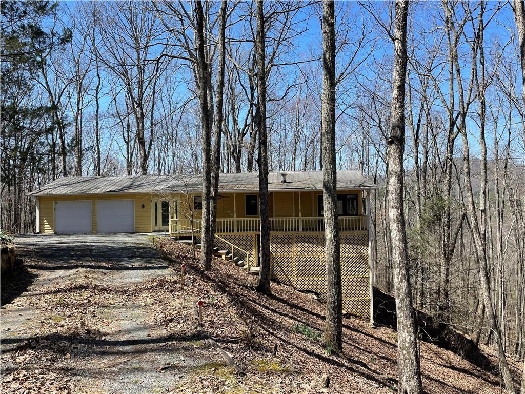 596 Ripshin Mountain Road Blue Ridge, GA 30513 - Photo 2 of 19 a view of a house with a yard