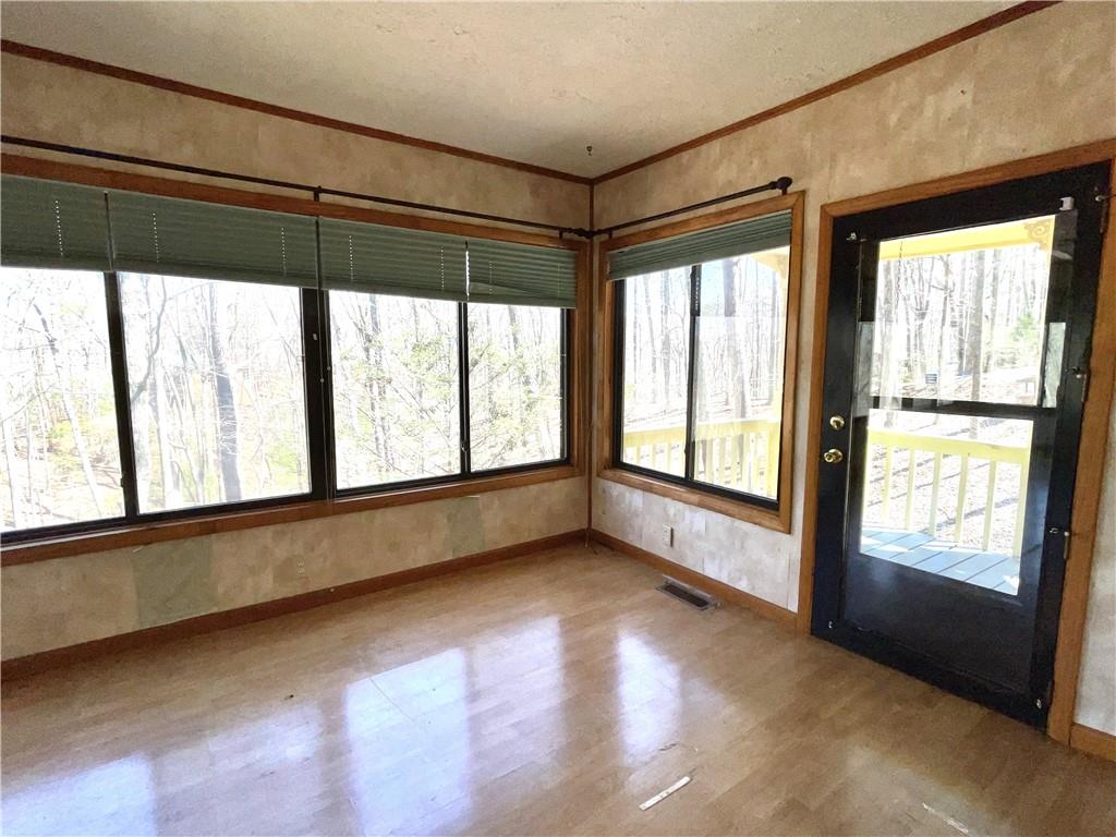 596 Ripshin Mountain Road Blue Ridge, GA 30513 - Photo 5 of 19 a view of an empty room with a window