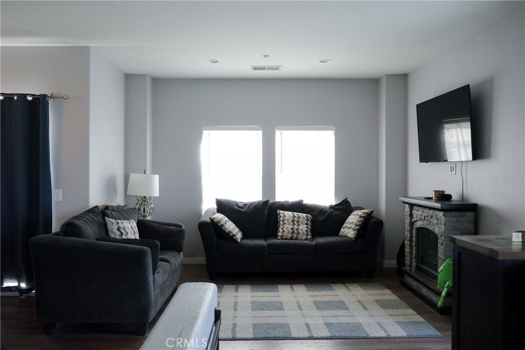 7331 Shelby Place Rancho Cucamonga, CA 91739 - Photo 5 of 17 a living room with furniture and a flat screen tv