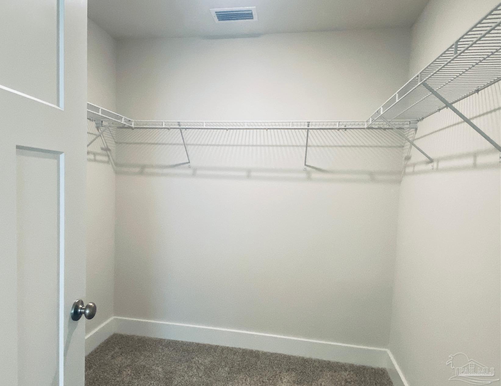 3021 Serviceberry Road Cantonment, FL 32533 - Photo 14 of 21 a view of a room with racks on the wall