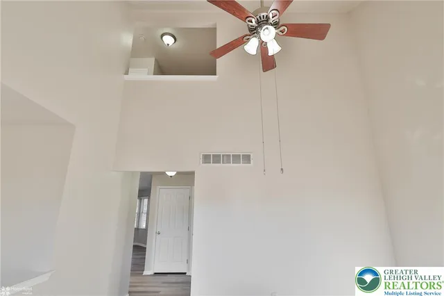 a view of room with wooden floor