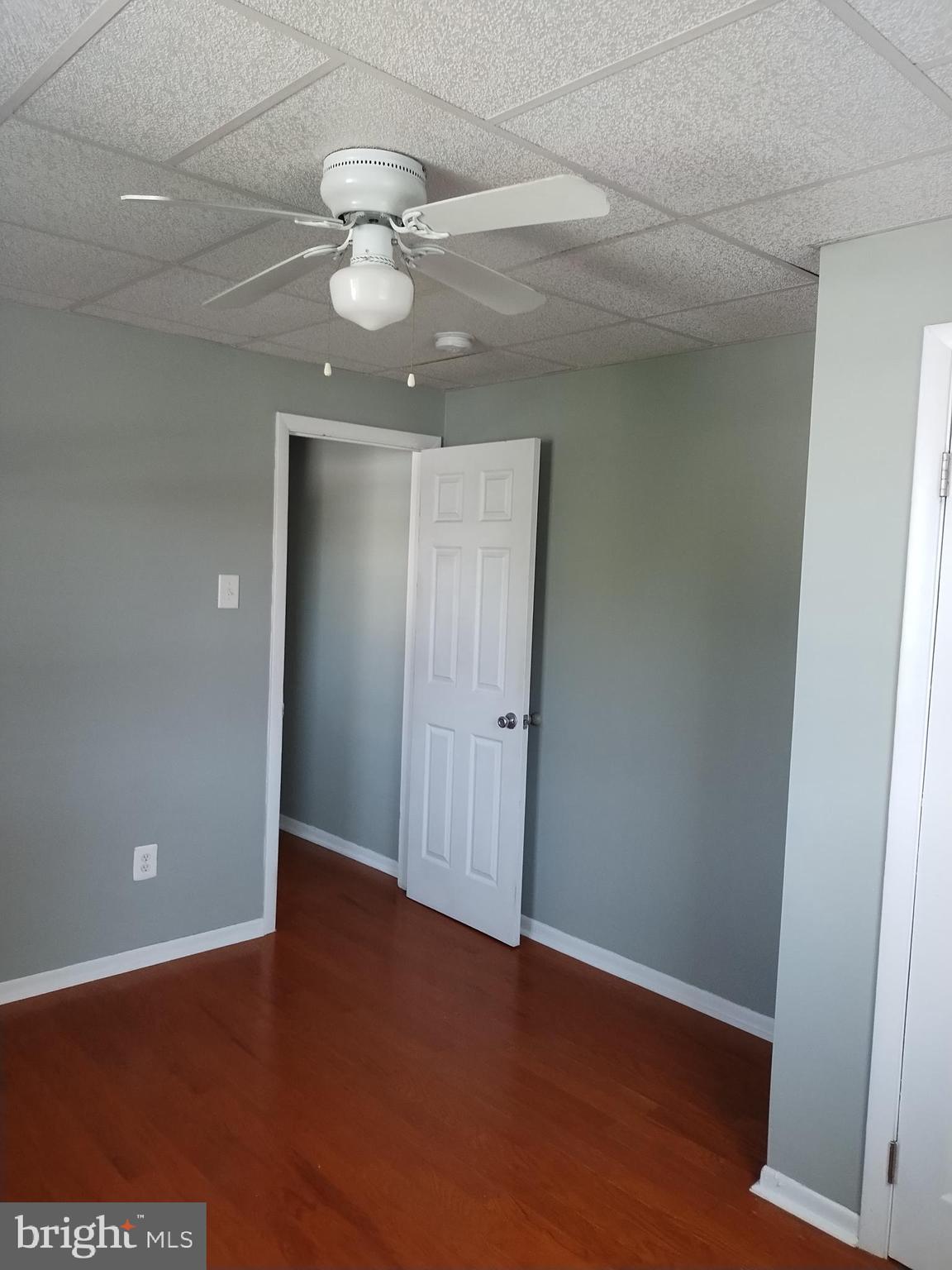 1112 Carpenter Street Philadelphia, PA 19147 - Photo 12 of 19 an empty room with wooden floor and windows