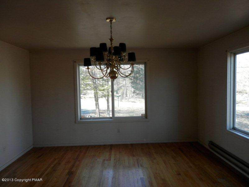 1103 Elgin Way Bushkill, PA 18324 - Photo 3 of 11 a view of an empty room with wooden floor and a window
