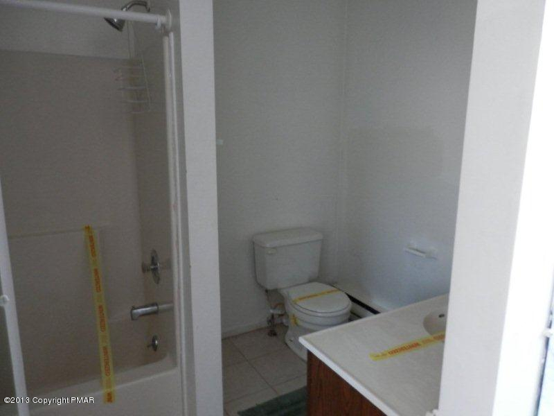 1103 Elgin Way Bushkill, PA 18324 - Photo 7 of 11 a bathroom with a toilet and a sink