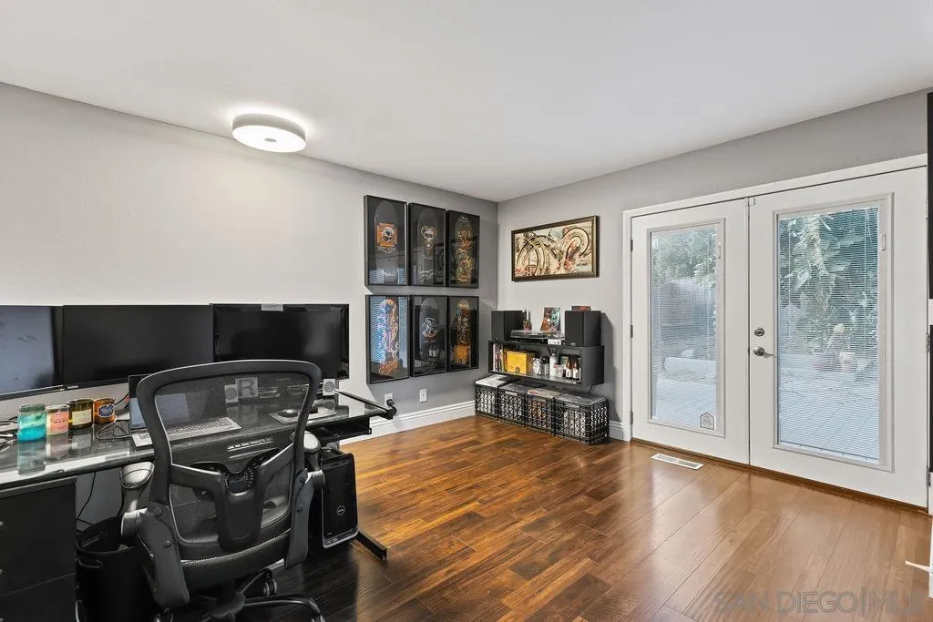 1570 Linwood Street San Diego, CA 92103 - Photo 12 of 36 a room with furniture a flat screen tv and a window