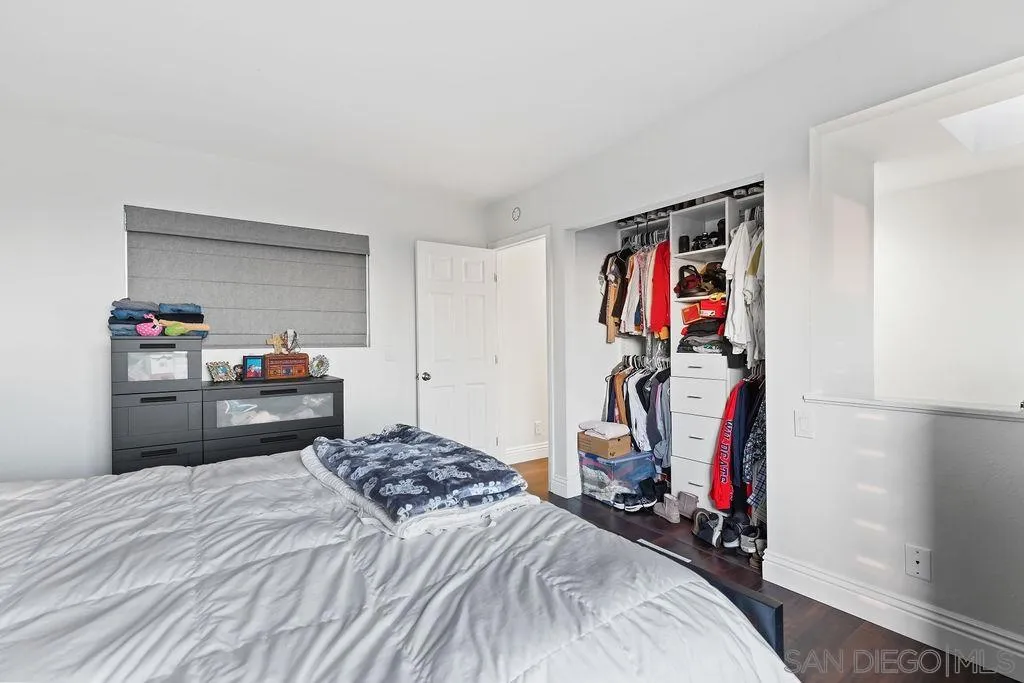 1570 Linwood Street San Diego, CA 92103 - Photo 16 of 36 a bedroom with a bed and a tv in it