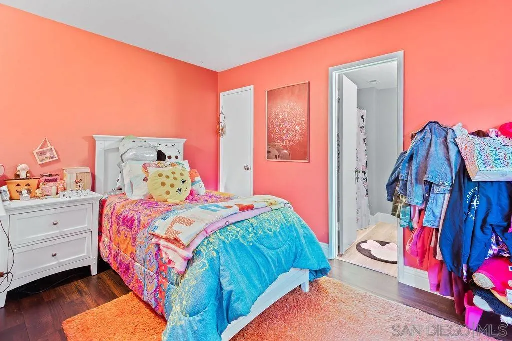 1570 Linwood Street San Diego, CA 92103 - Photo 24 of 36 a bedroom with a bed and a window