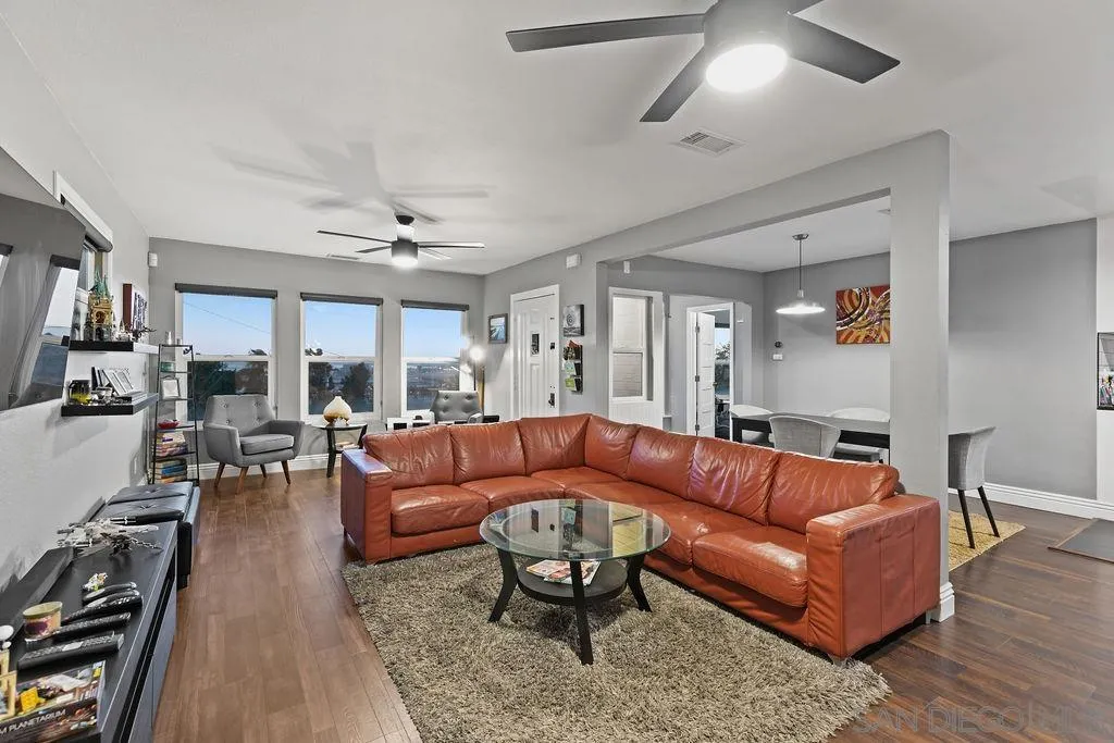 1570 Linwood Street San Diego, CA 92103 - Photo 6 of 36 a living room with furniture a ceiling fan and a rug