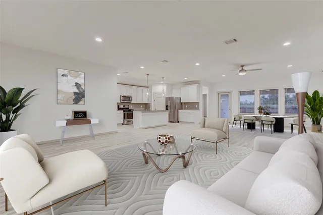 a spacious bedroom with a bed and window