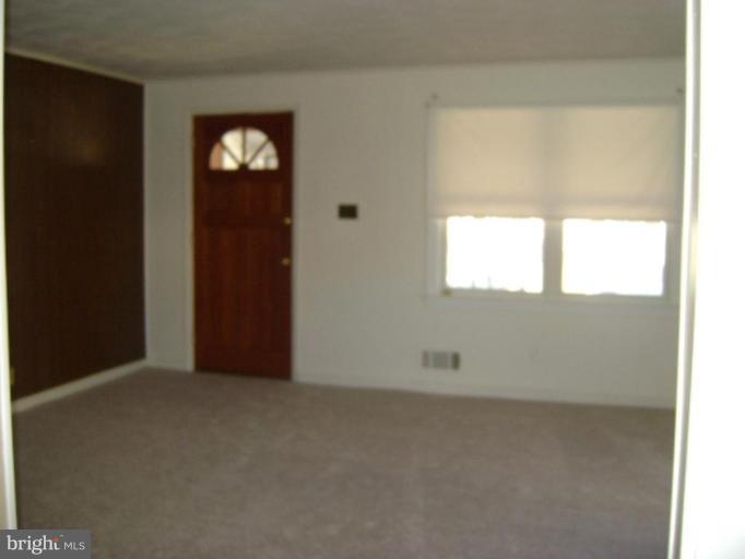 201 Riverthorn Road Middle River, MD 21220 - Photo 5 of 12 an empty room with windows