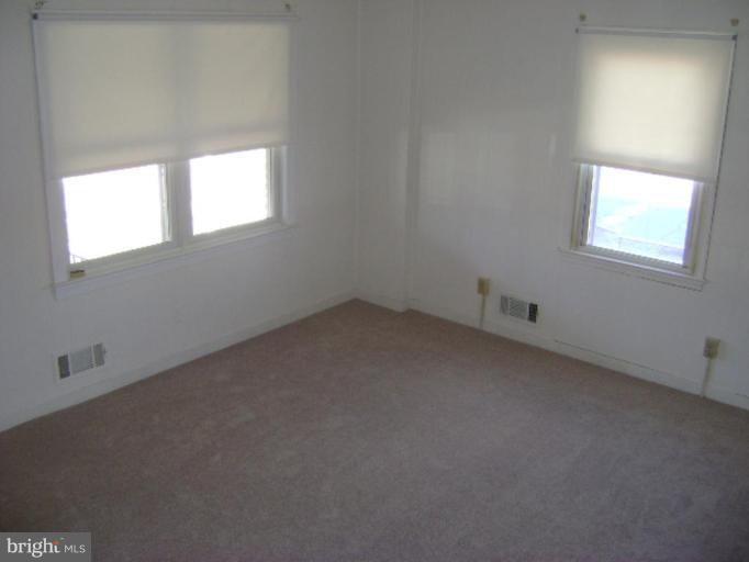 201 Riverthorn Road Middle River, MD 21220 - Photo 7 of 12 an empty room with a window