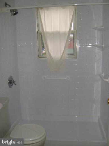 201 Riverthorn Road Middle River, MD 21220 - Photo 9 of 12 a bathroom with a toilet and a shower