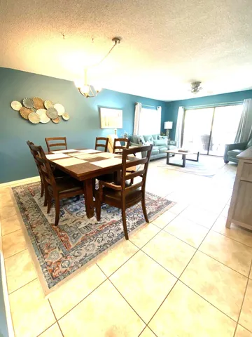 a view of a swimming pool with outdoor seating