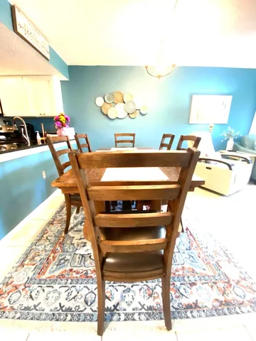 a room with a table chairs and a dining table