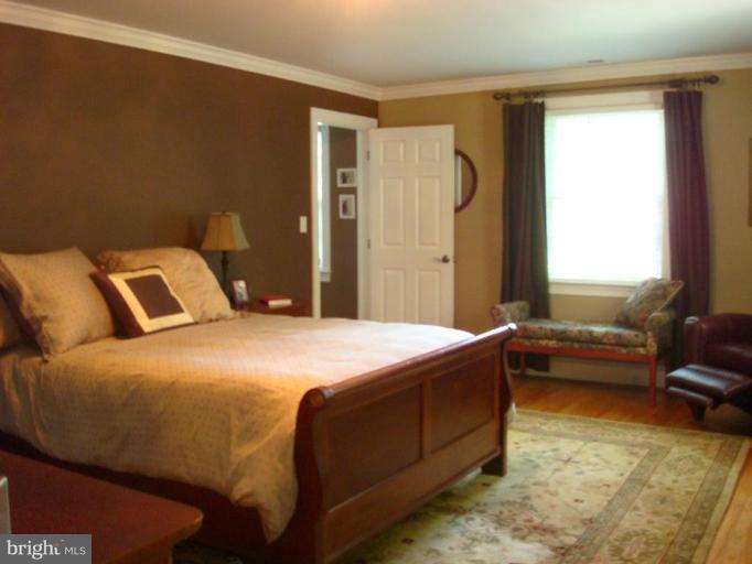 13603 Bardon Road Phoenix, MD 21131 - Photo 13 of 30 a bedroom with a bed and a couch
