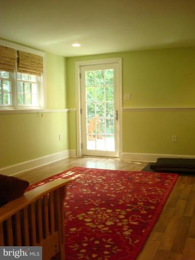 13603 Bardon Road Phoenix, MD 21131 - Photo 28 of 30 a view of an empty room with wooden floor and a window