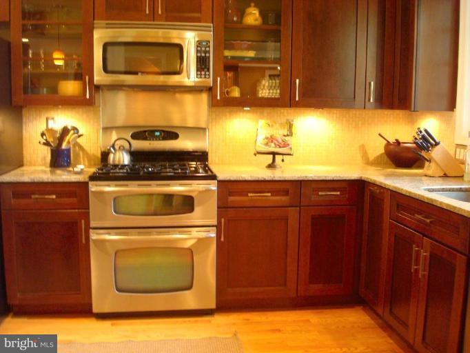 13603 Bardon Road Phoenix, MD 21131 - Photo 7 of 30 a kitchen with a sink cabinets and appliances
