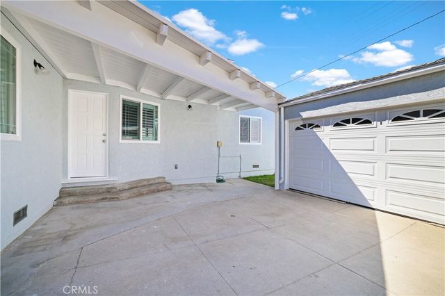 a view of an empty room with windows