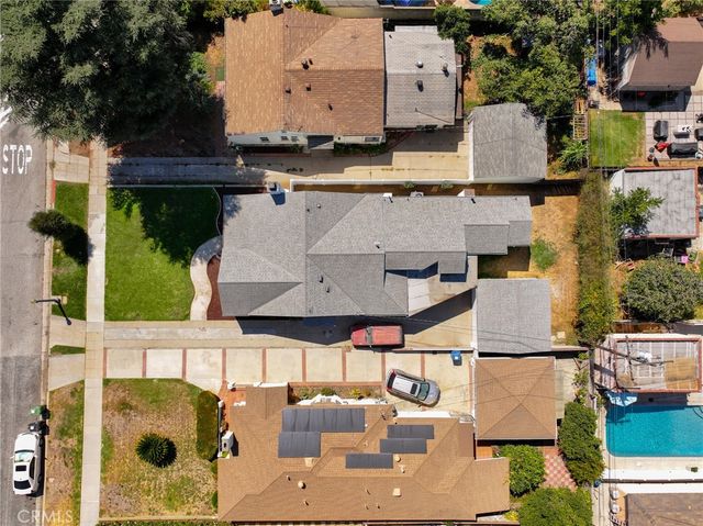 an aerial view of residential houses with outdoor space