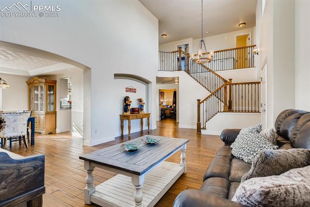8380 Del Rio Road Peyton, CO 80831 - Photo 3 of 25 Additional view of this lovely formal living room and stairway to the upper level.