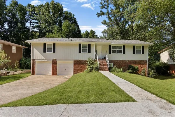 a front view of a house with yard