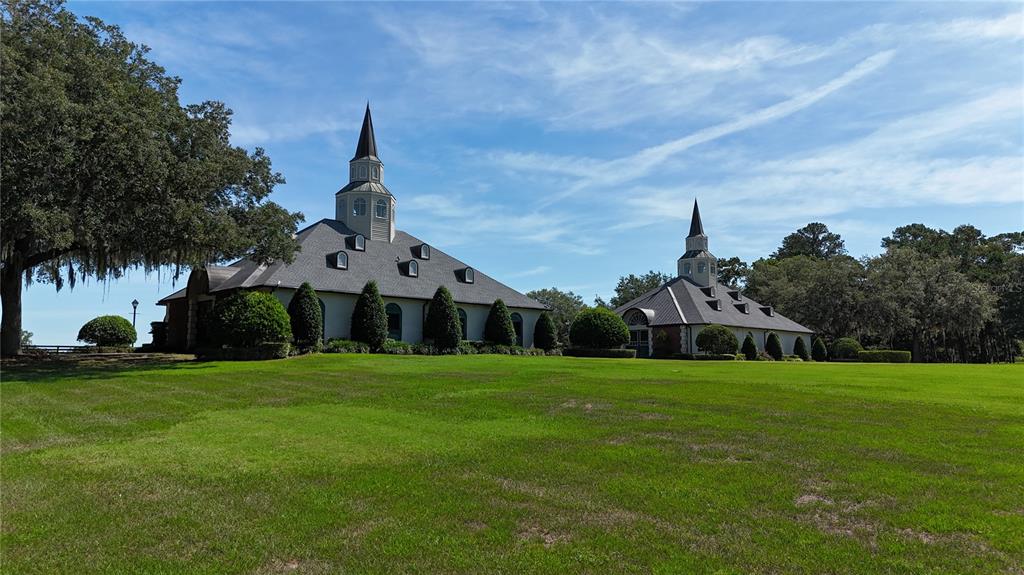 6800 Northwest 193rd Street, Unit OPTION 1 Reddick, FL 32686 - Photo 11 of 32 a front view of a house with a garden