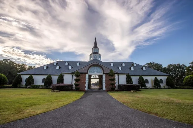 a front view of a house with a yard and porch