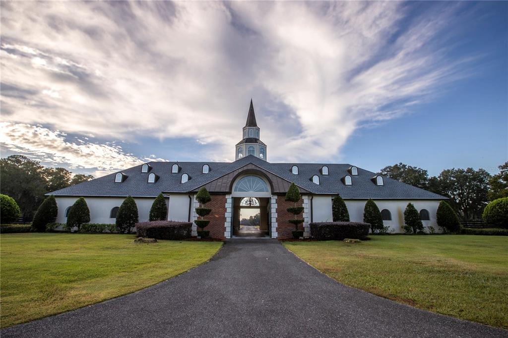 6800 Northwest 193rd Street, Unit OPTION 1 Reddick, FL 32686 - Photo 16 of 32 a front view of a house with a yard and porch