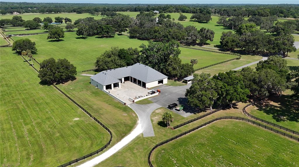 6800 Northwest 193rd Street, Unit OPTION 1 Reddick, FL 32686 - Photo 26 of 32 a view of a swimming pool with a yard