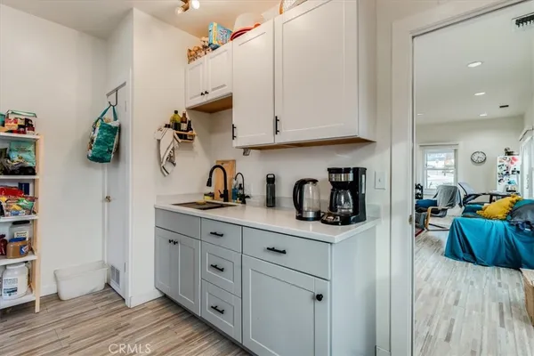 a kitchen with stainless steel appliances granite countertop a sink dishwasher stove and cabinets