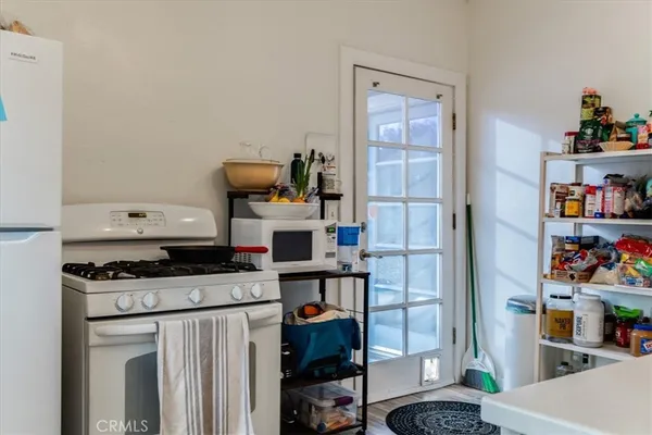 a kitchen with stainless steel appliances granite countertop a stove and a cabinets