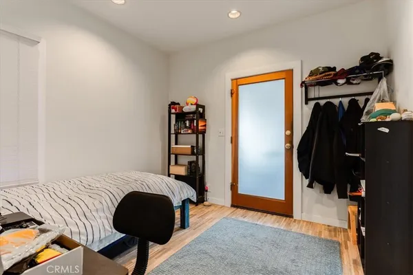 a bedroom with a bed and a closet