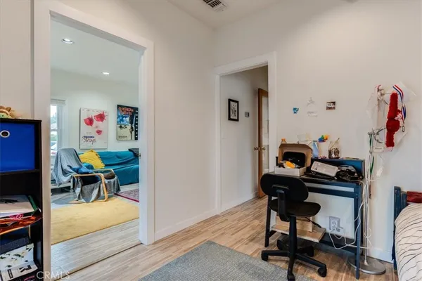 a view of a workspace with furniture and toys