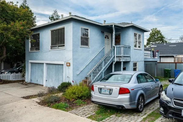 a front view of a house with parking space