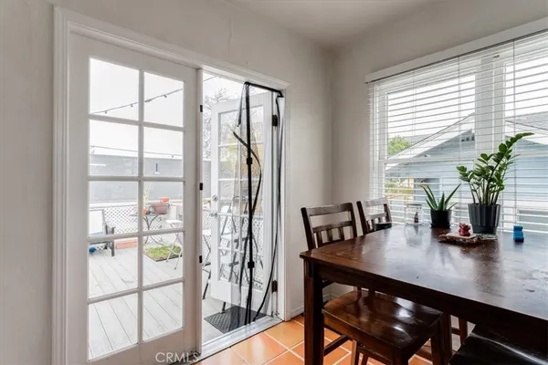 a view of a dining room with furniture and window