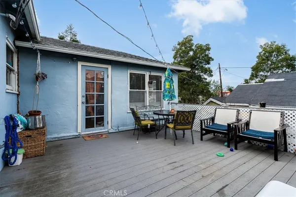 a view of a patio with table and chairs and potted plants
