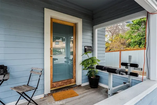 a kitchen with a table and chairs in front of it