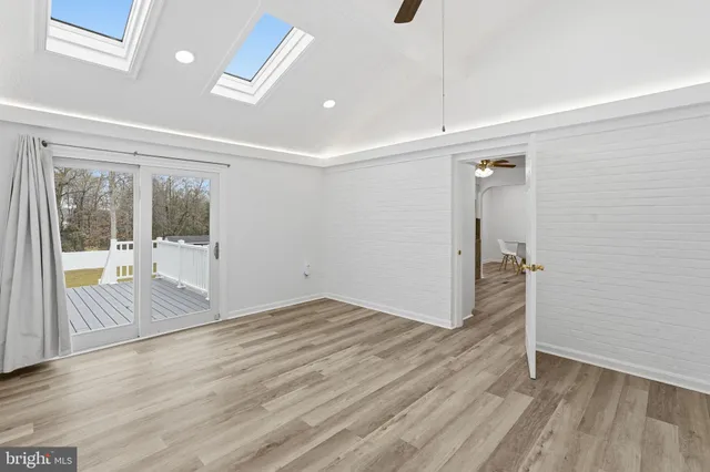 a view of an empty room with glass door