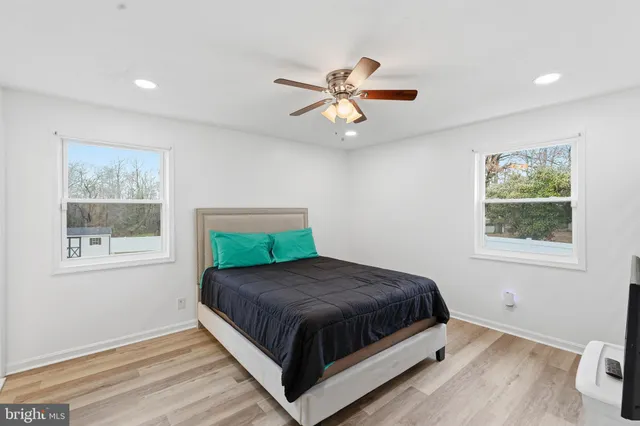 a bedroom with a bed and window