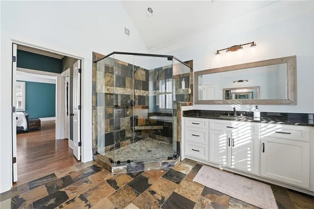 a large white kitchen with cabinets