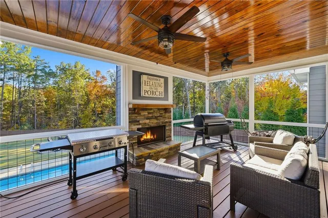 a outdoor living space with patio furniture and a fireplace