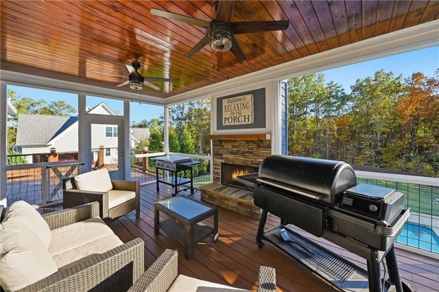 a balcony with wooden floor and furniture