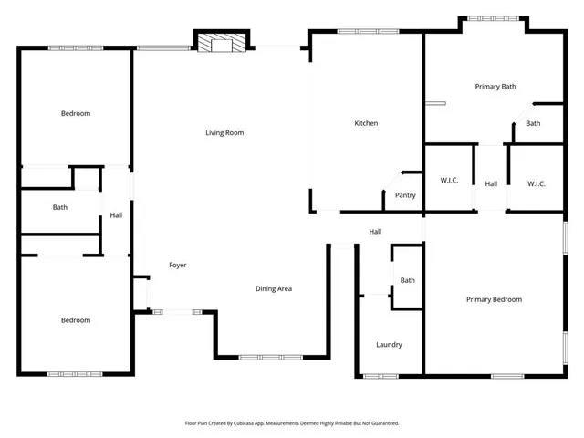 a picture of a bathroom with a white wall