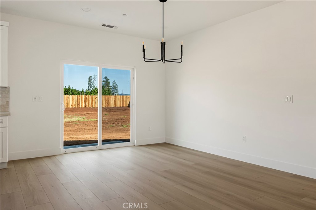 7278 Pentz Road Paradise, CA 95969 - Photo 18 of 36 a view of empty room with wooden floor and window