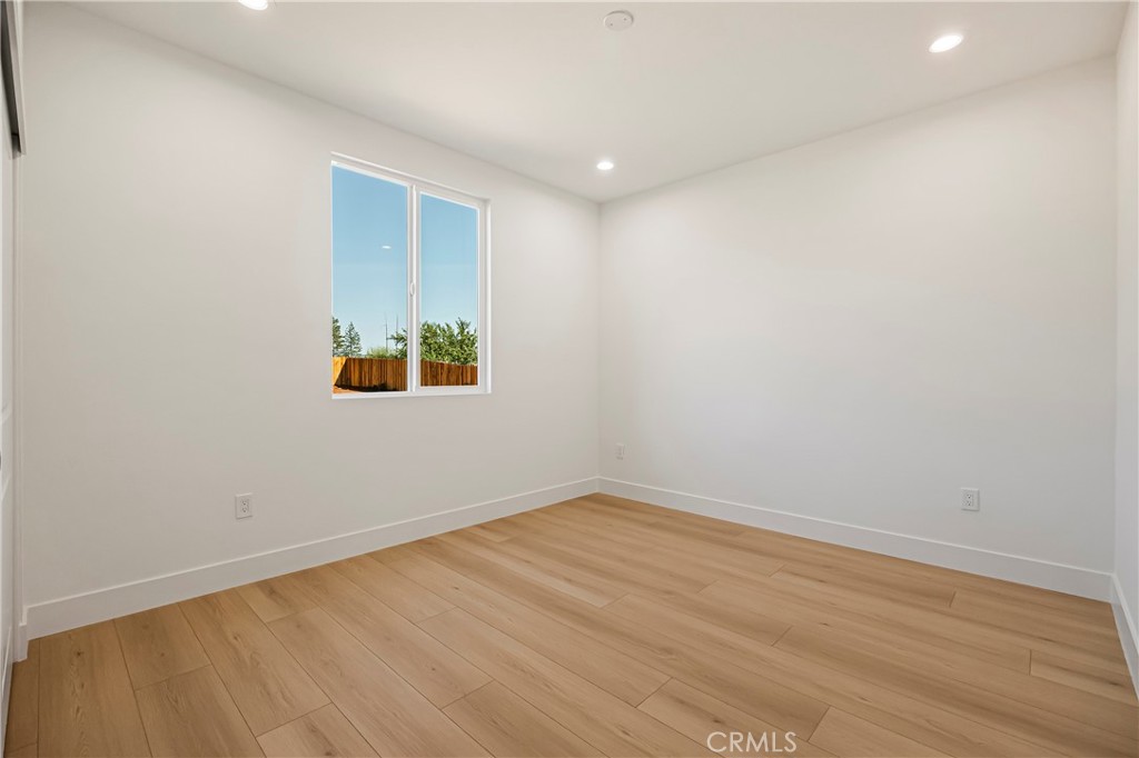 7278 Pentz Road Paradise, CA 95969 - Photo 19 of 36 an empty room with wooden floor and windows