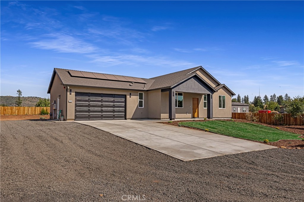 7278 Pentz Road Paradise, CA 95969 - Photo 7 of 36 a front view of a house with a yard and garage