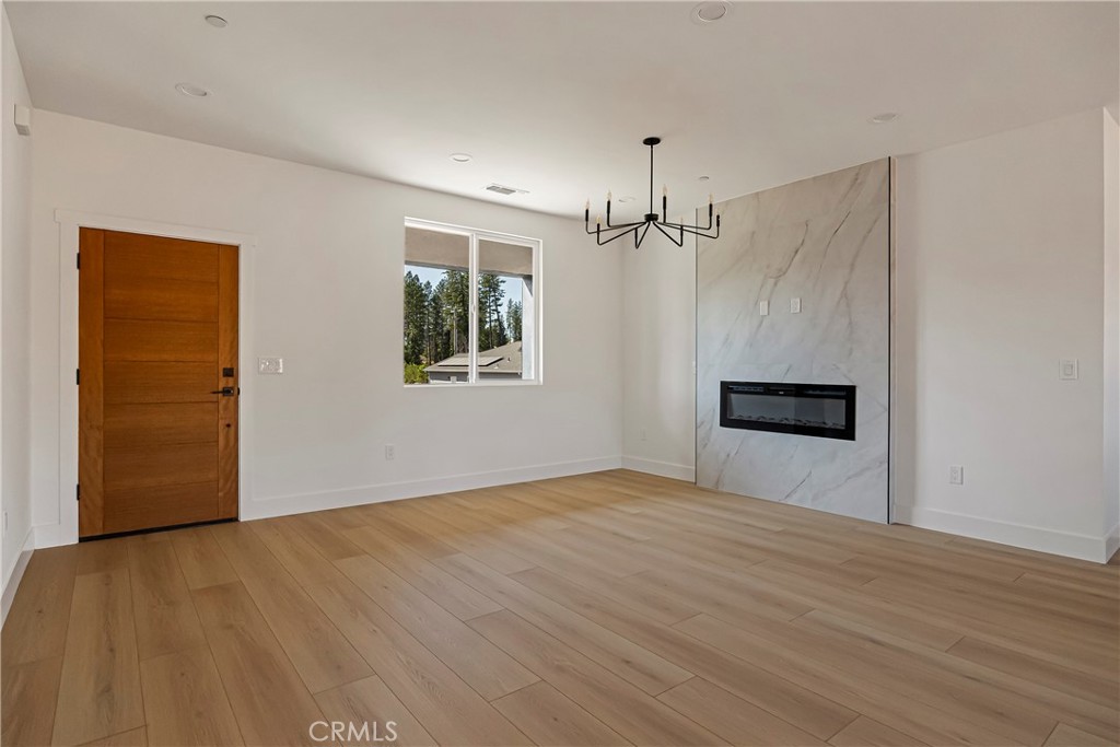 7278 Pentz Road Paradise, CA 95969 - Photo 10 of 36 a view of an empty room with wooden floor and a window