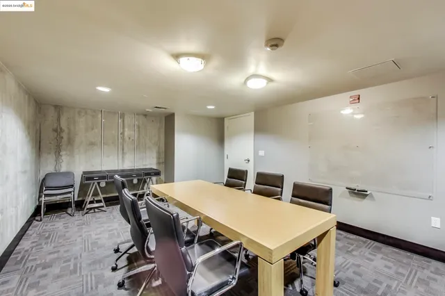 a room with pool table and windows