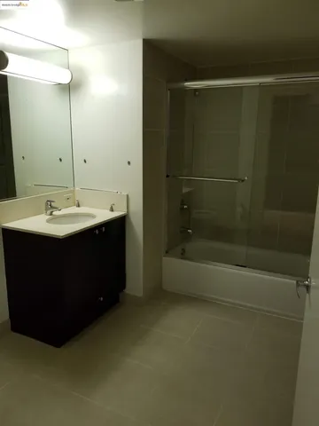 a view of walk in closet with clothes